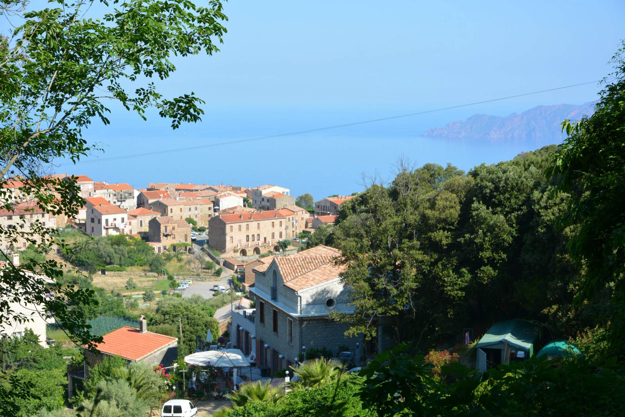 Hilltop village with a view of the Mediterranean Sea in Corsica.