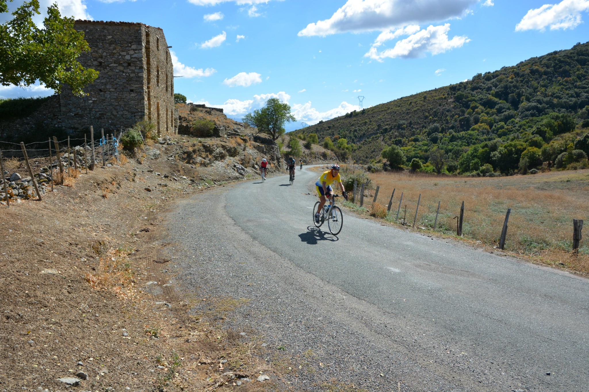 Cyclist riding on a country road in Corsica.